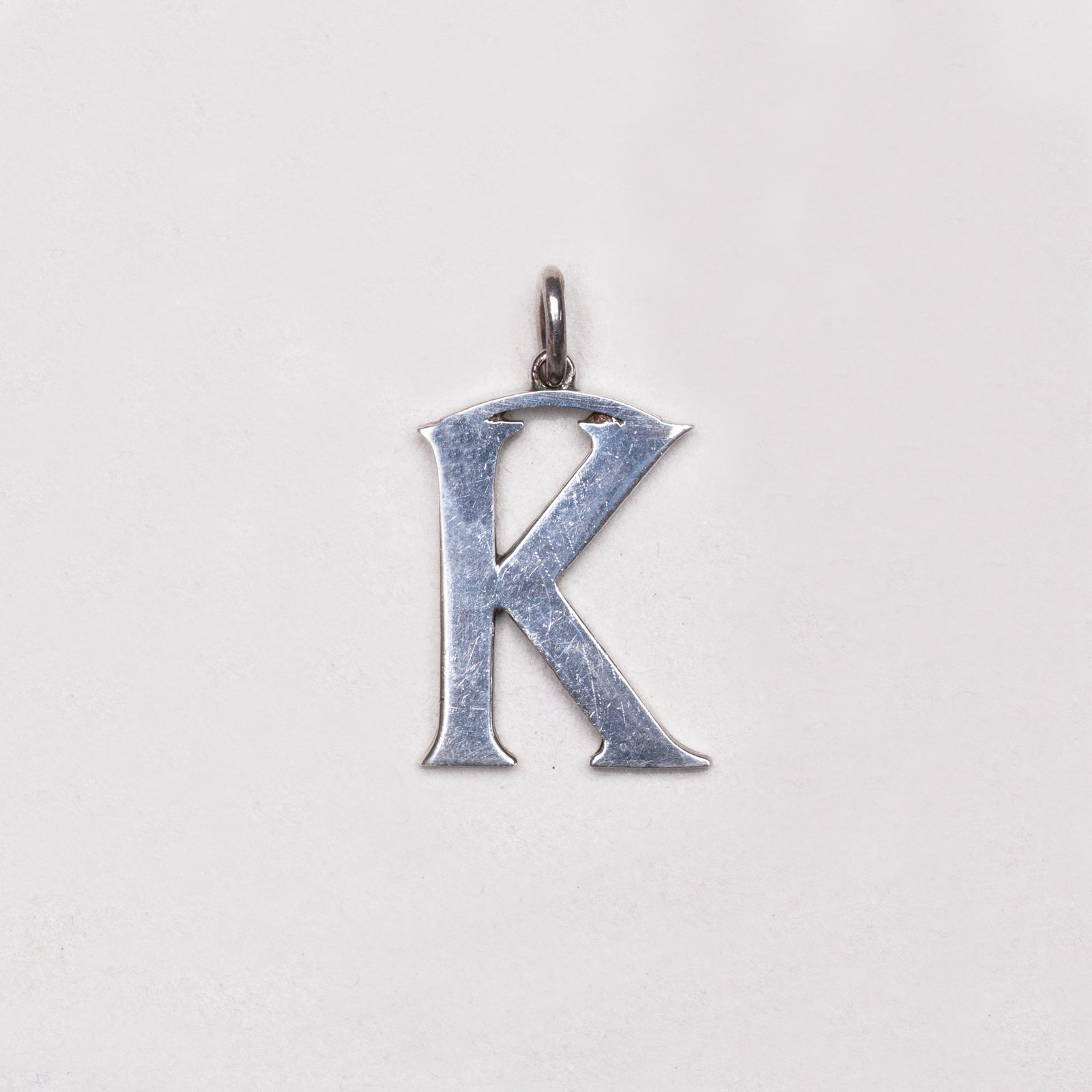 Vintage Cassandra Goad "K" Charm Pendant in Sterling Silver