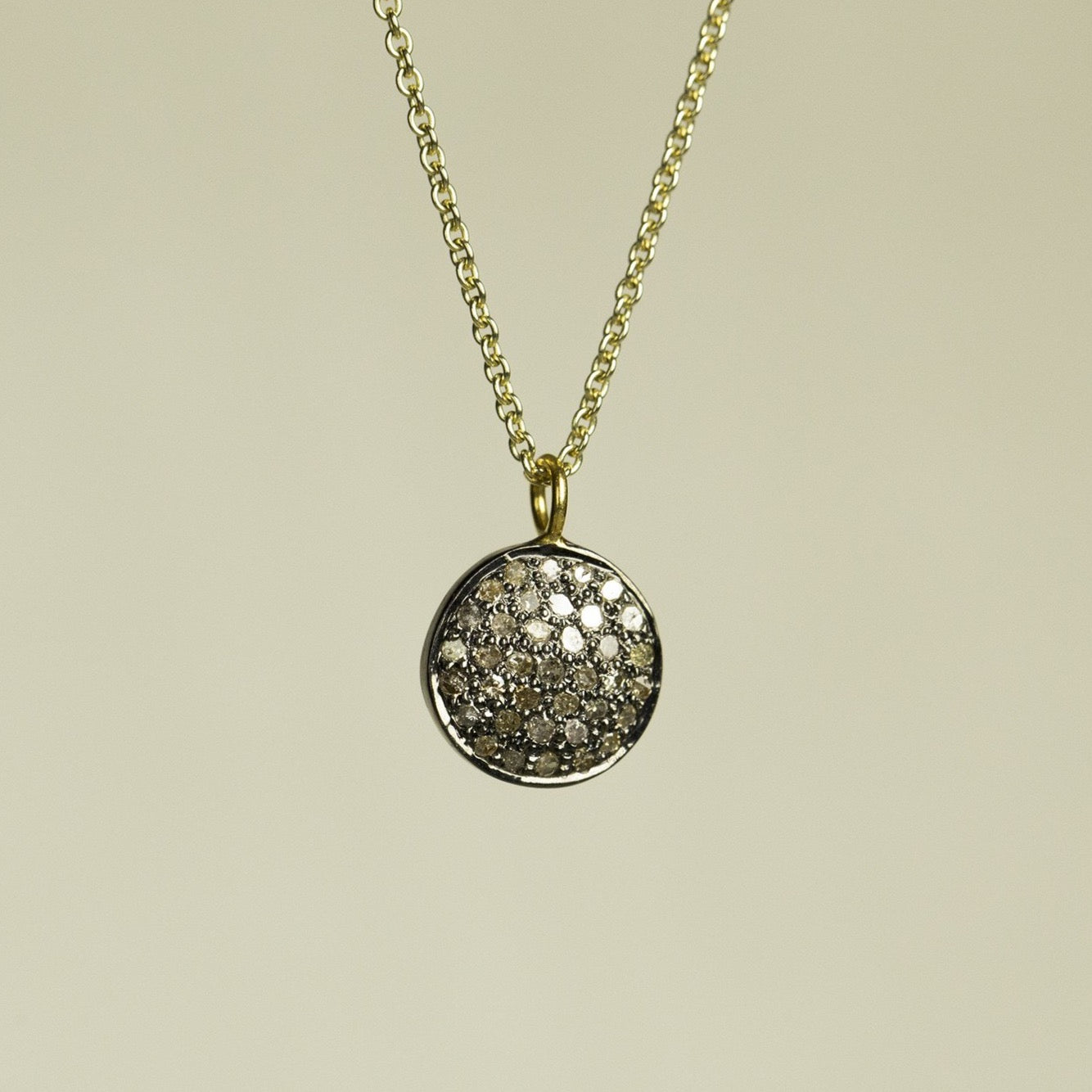 bright but not really diamond disc set in oxidised silver - for fans of the understated