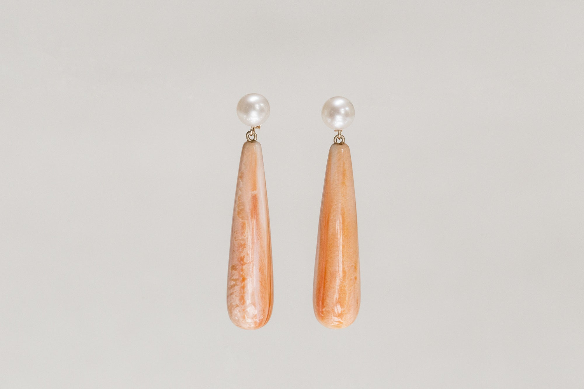 Claire van Holthe orange shell long drop, freshwater pearl and 9 carat gold modern drop earrings