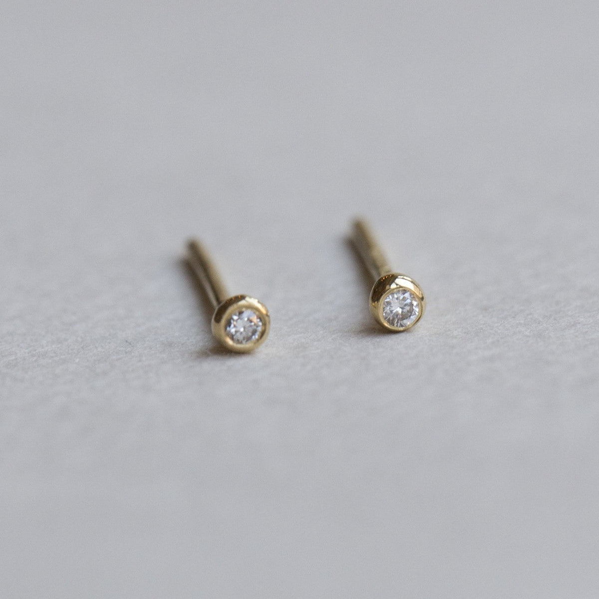 felt diamond blob stud earrings close up 
