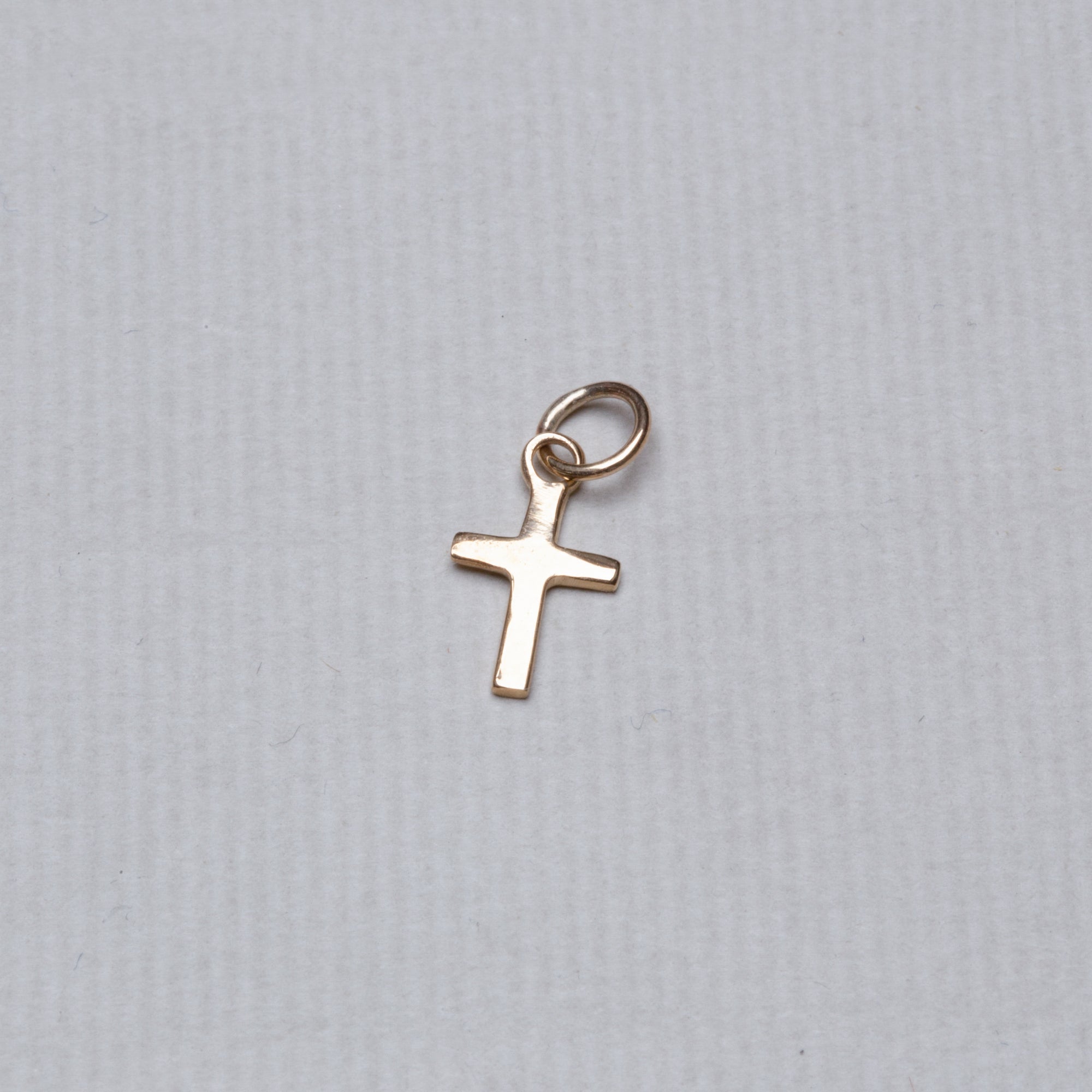 felt's very own design - adorable tiny cross pendant