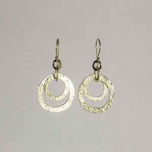 an entwined hoop earrings made of textured gold plated silver