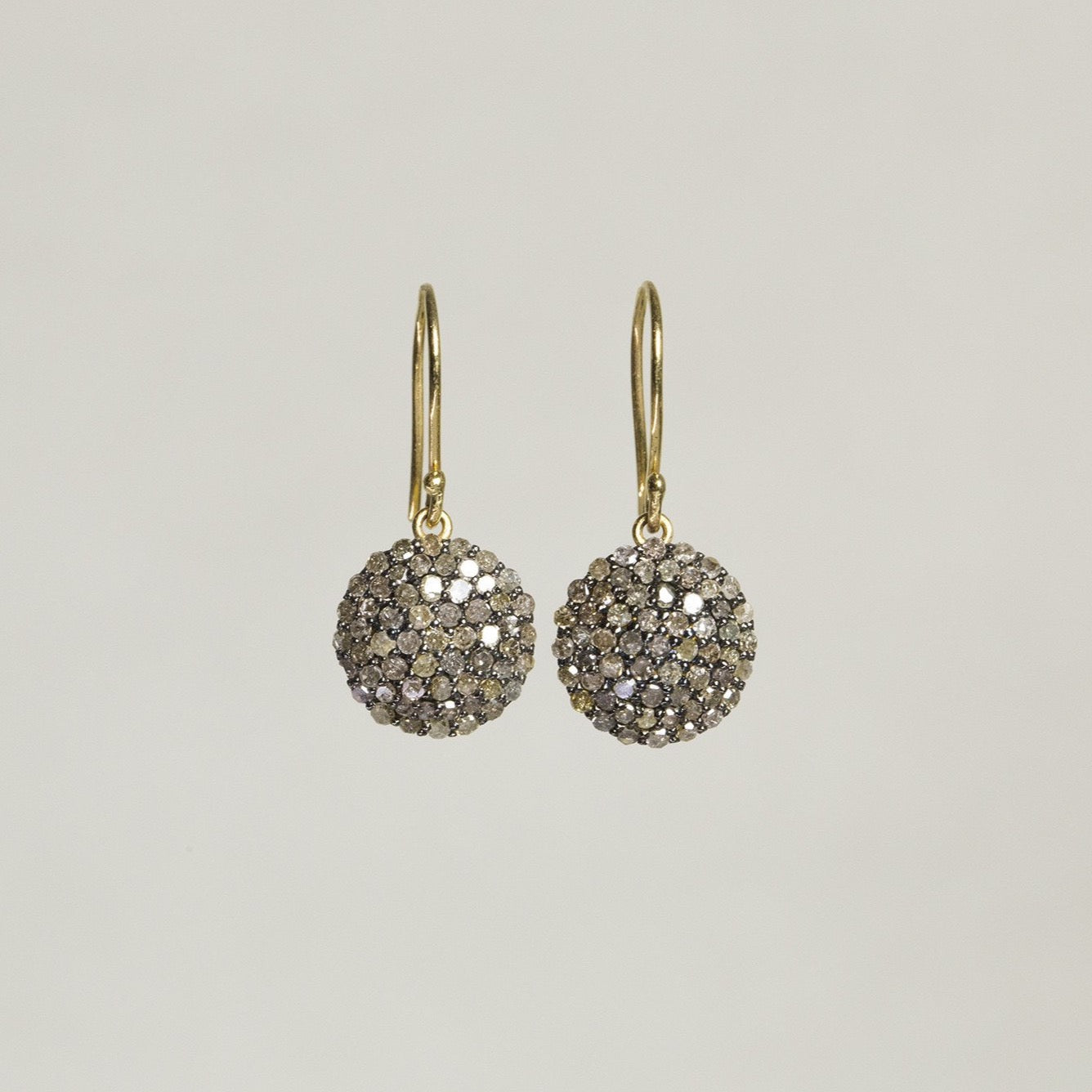 beautiful diamond pave set in oxidised silver with 18 carat gold hooks