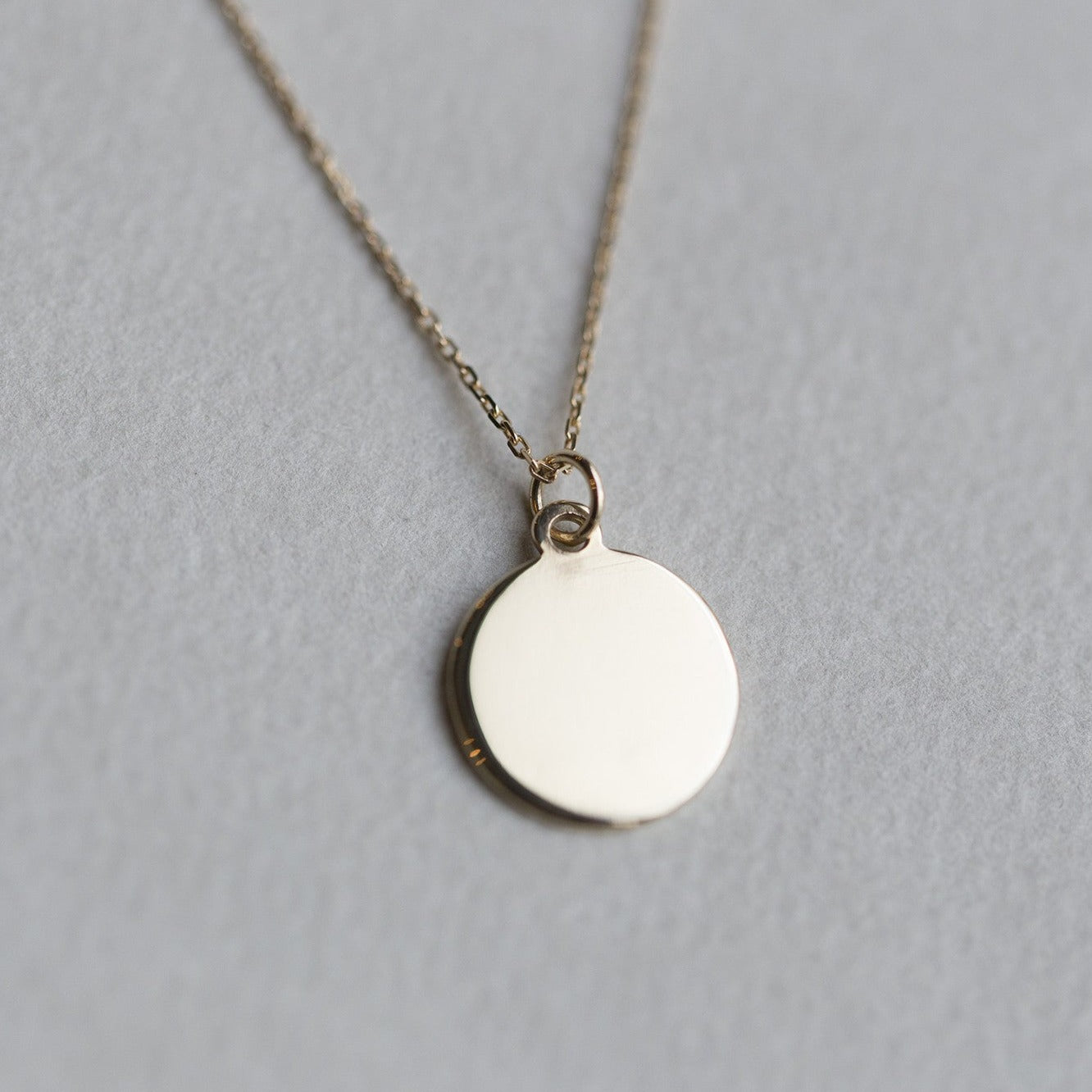 felt's own design - incredibly simple and enchanting polished gold disc 