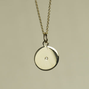 felt's own design - incredibly simple and enchanting polished gold disc with diamond on 9 carat gold chain
