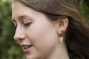 the fantastic arrow heads hoops are complemented by Laura Gravestock lips studs and felt's own silver disc studs.