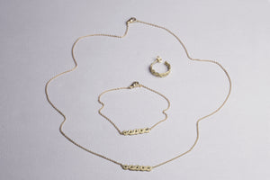 A matching set - necklace, bracelet and hoops