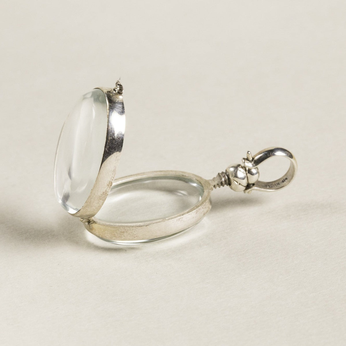 opened oval locket seen from the side - same screw design is used in the round lockets